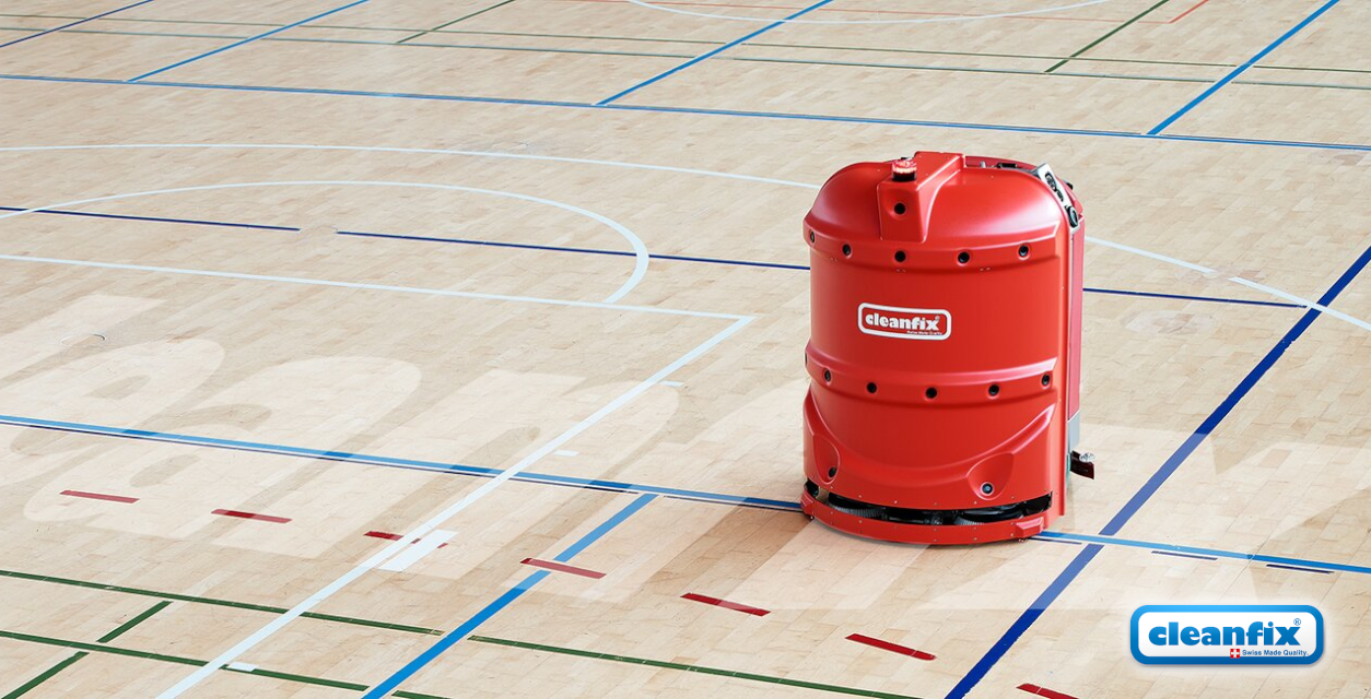 Een robot van Cleanflix die een sportzaal schoonmaakt